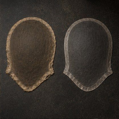 Two hair system bases side by side — the left worn and yellowed, the right new.